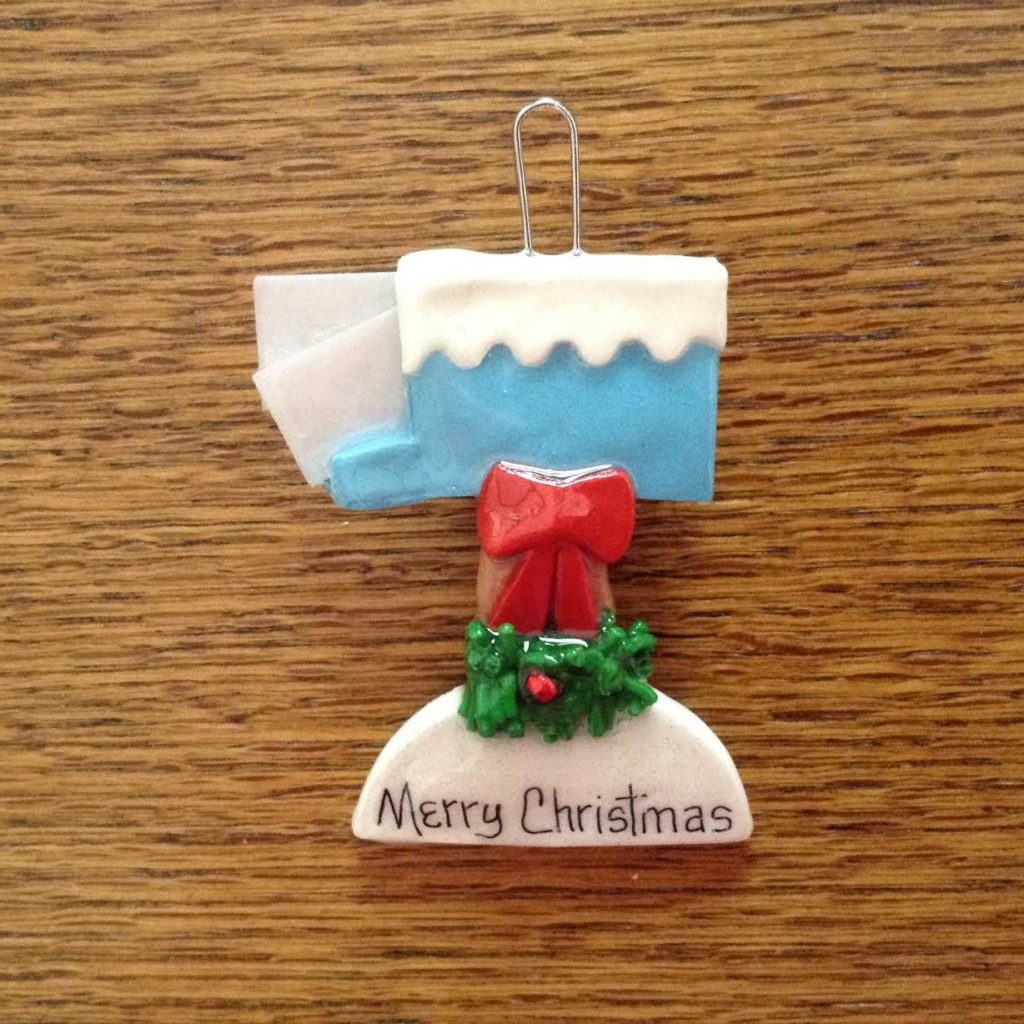 A christmas ornament that is on the table.