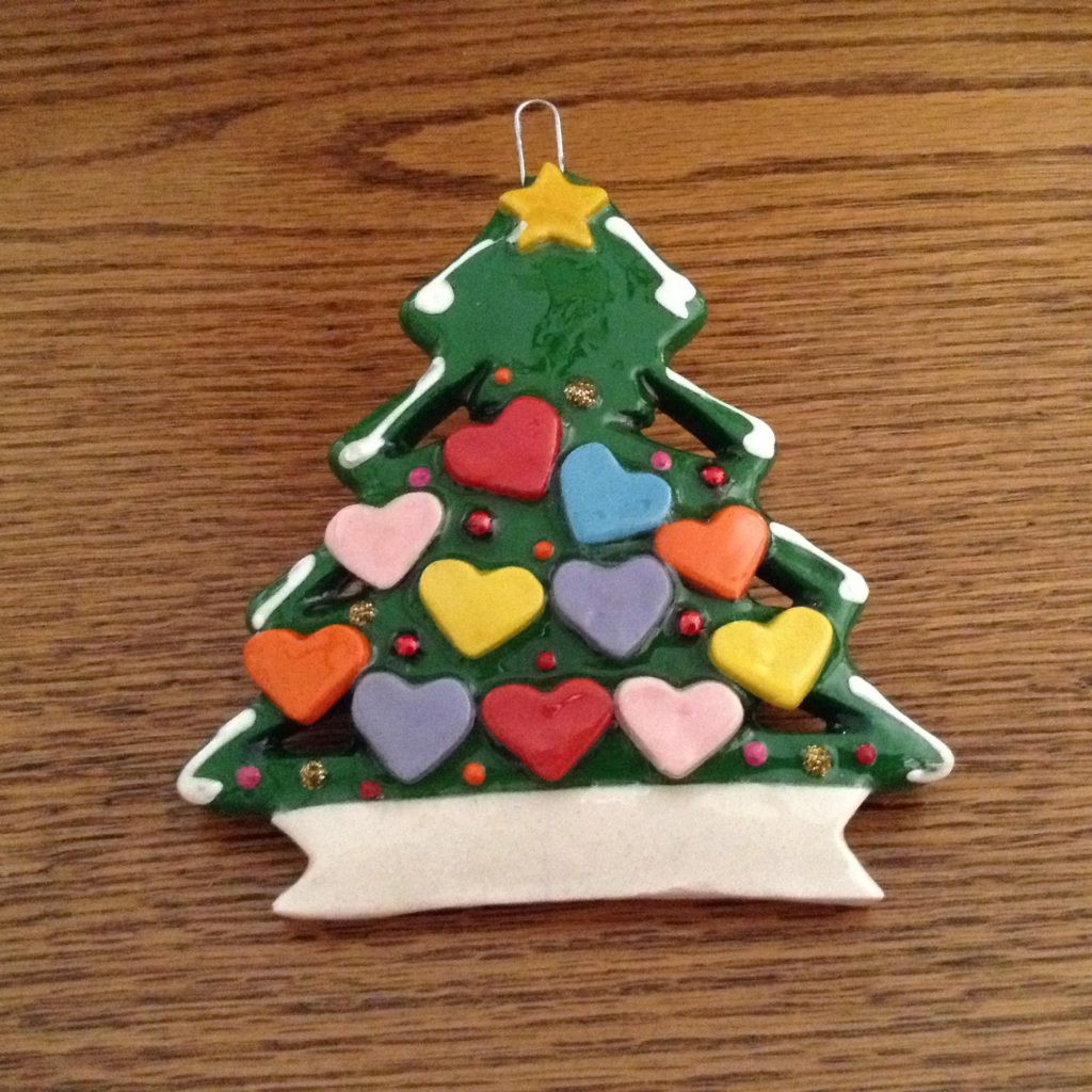 A christmas tree ornament with hearts on it.