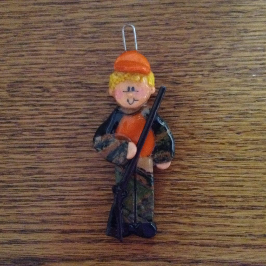 A small toy of a man with a rifle.