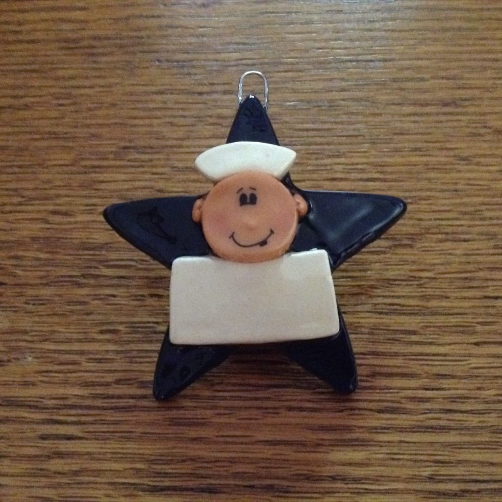 A sailor ornament is sitting on the table.
