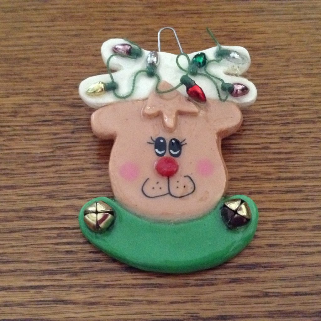 A christmas ornament with a bow on it.