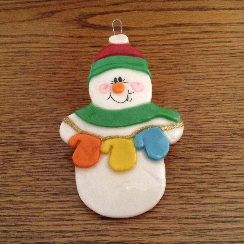A snowman ornament is shown on the table.