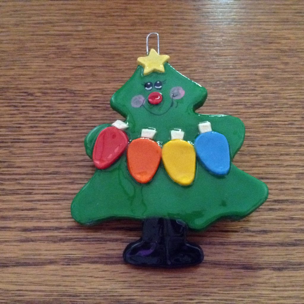 A christmas tree ornament with lights on it.