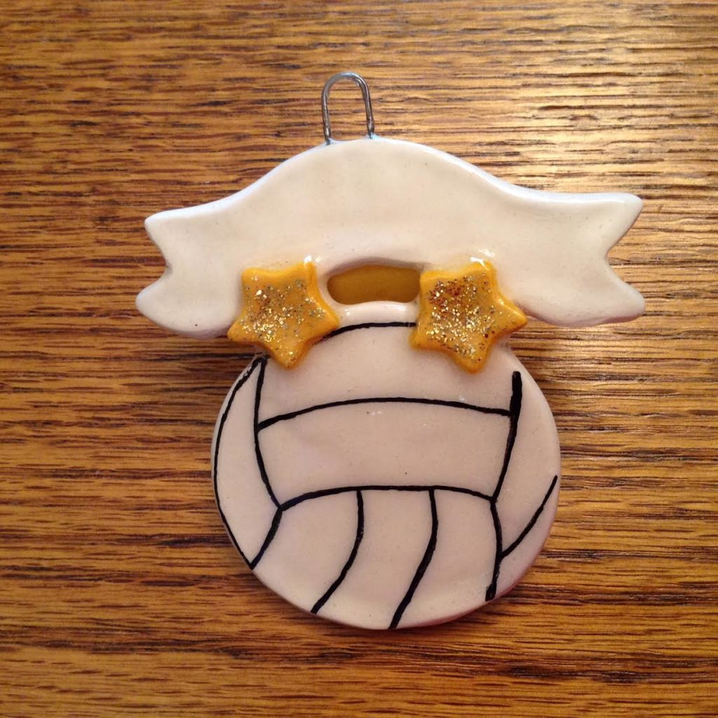 A volleyball ornament with a star on it.