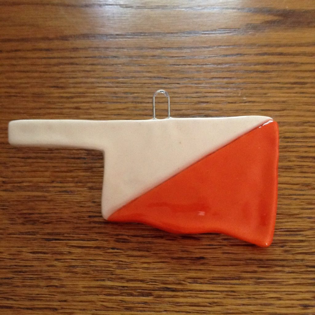 A red and white object is on the table.