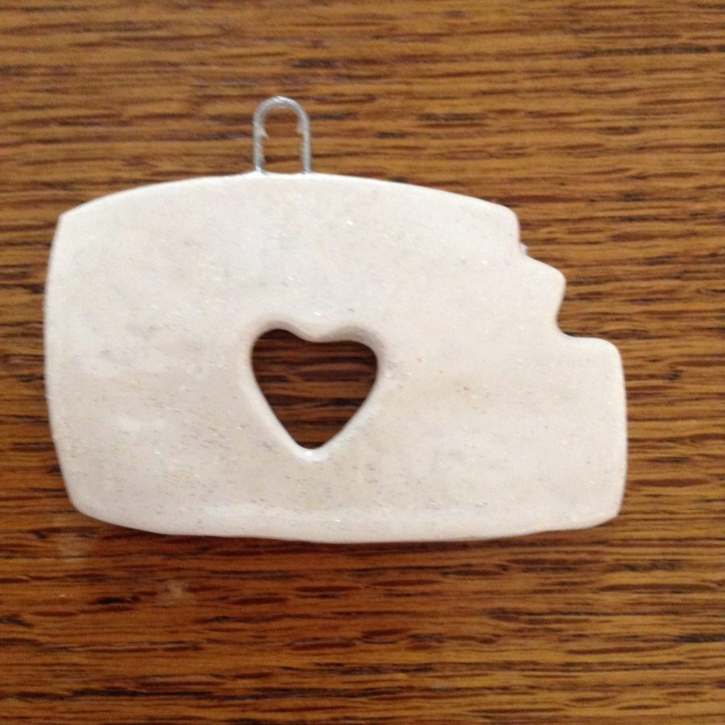 A white piece of paper with a heart cut out.