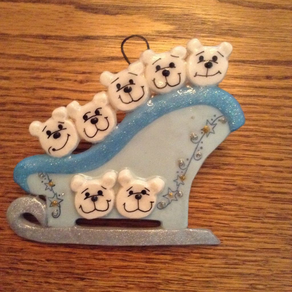 A blue sleigh with white bears on it.