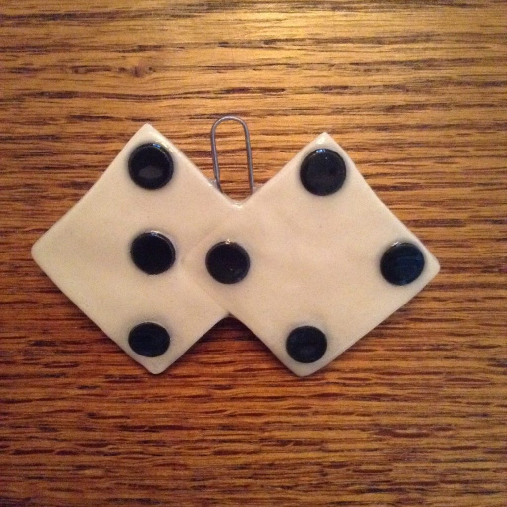 A pair of dice sitting on top of a wooden table.