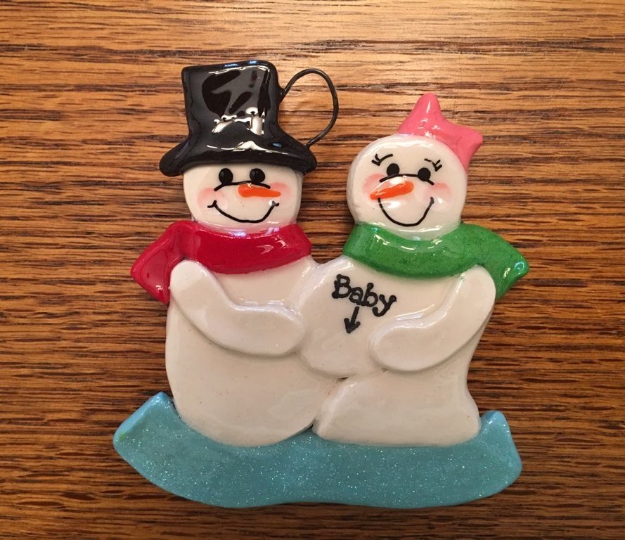 A couple of snowmen are standing next to each other