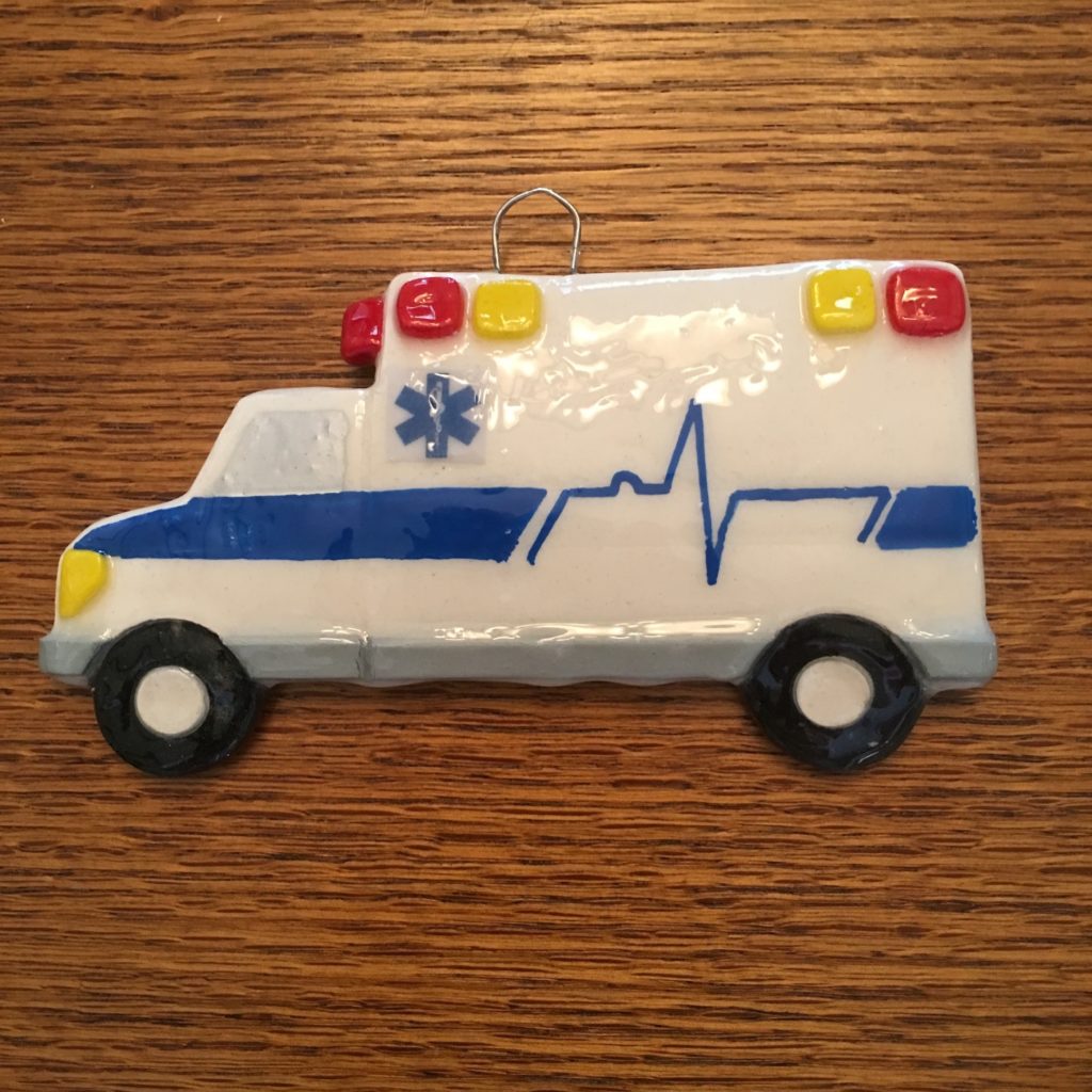 A toy ambulance is on the table.