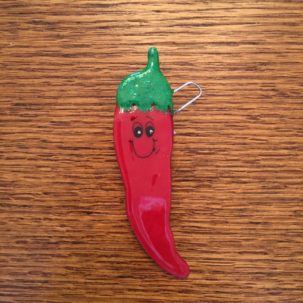A red chili pepper with a green top