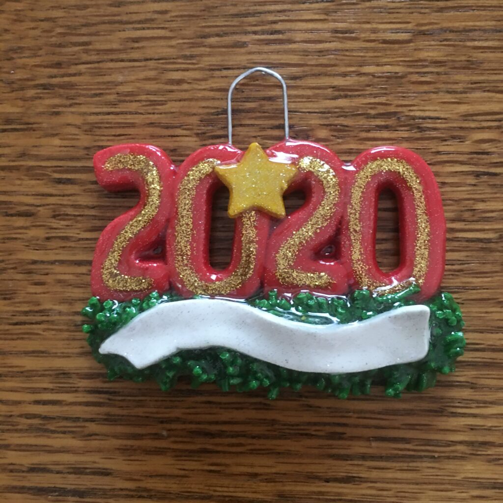 A red and gold ornament with the number 2 0 2 0.