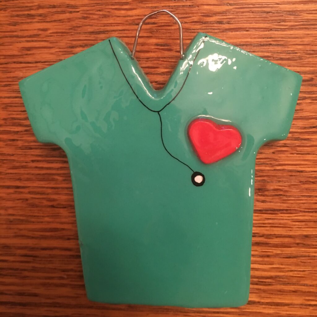 A green shirt with a heart on it