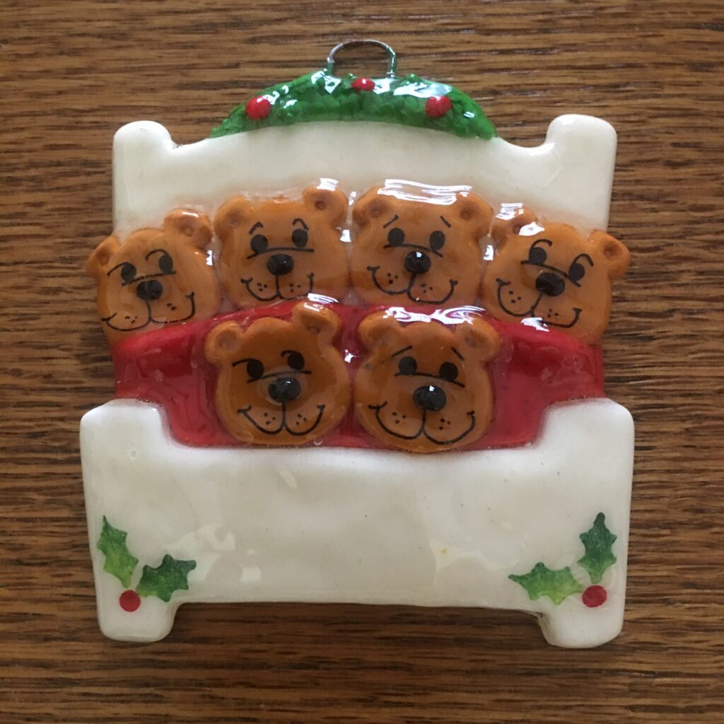 A christmas ornament with bears on it.