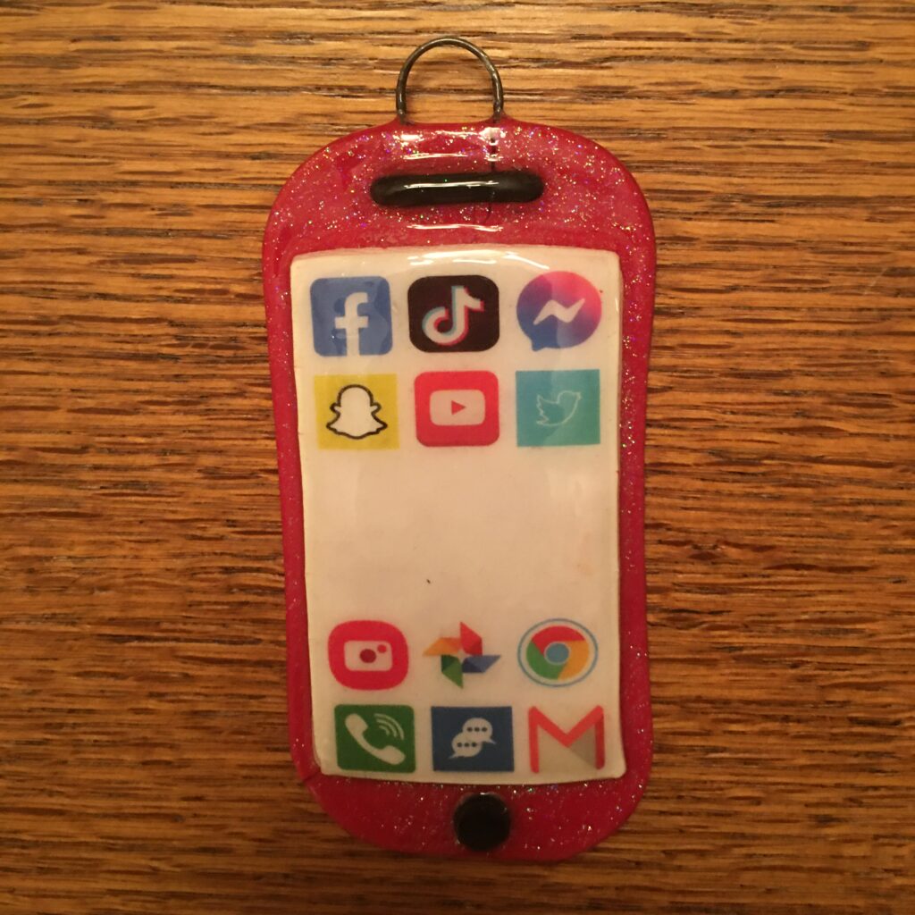 A red phone with many different social media icons on it.